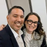 Joseph L. Soliz smiling with a colleague at an industry conference